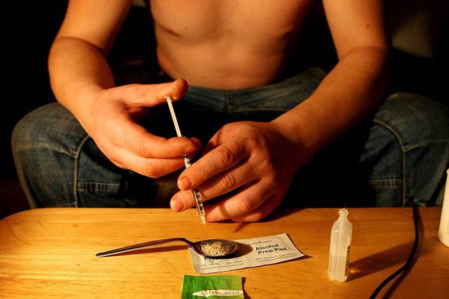 An addict taking heroin - Julien Behal/PA Archive/PA Images