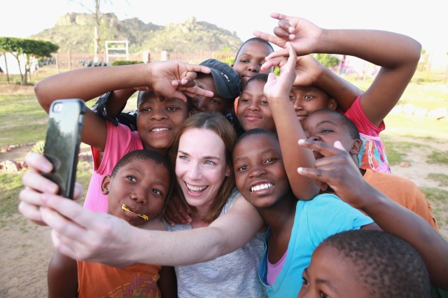 Call the Midwife's Laura Main takes a selfie with hearing impaired children at Kananelo School during a Sentebale programme visit in Kananelo, Lesotho.   (Photo by Chris Jackson/Getty Images)
