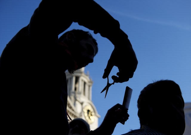 A barber today takes the same amount of time to cut a customer's hair as his 18th century predecessor. Credit: Getty