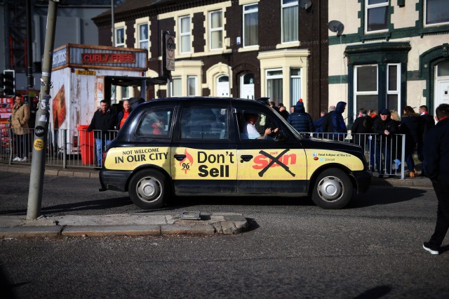 A taxi promoting the Liverpudlian boycott of The Sun newspaper. Credit: Simon Stacpoole/Offside/Getty