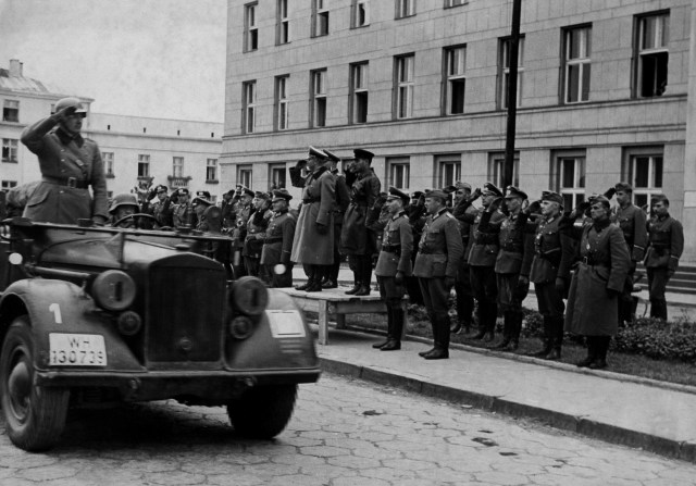German and Soviet troops salute each other at Brest-Litovsk in September 1939. The two countries worked together to dismember Poland (Ullstein Bild via Getty Images)