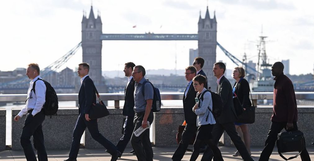 Commuters walk across London Bridge. Credit: Getty