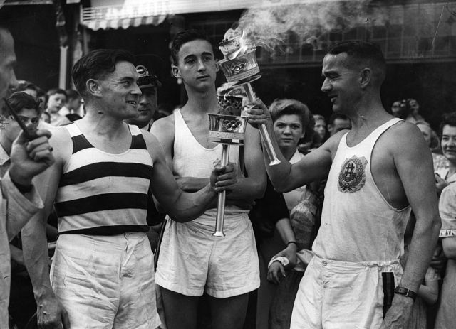 The Olympic flame is passed at the 1948 Olympiad. Credit: Topical Press Agency/Getty