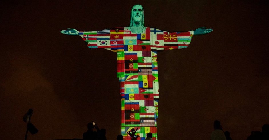 Christ the Redeemer has been lit up with a projection of flags of all the countries that have been affected by coronavirus