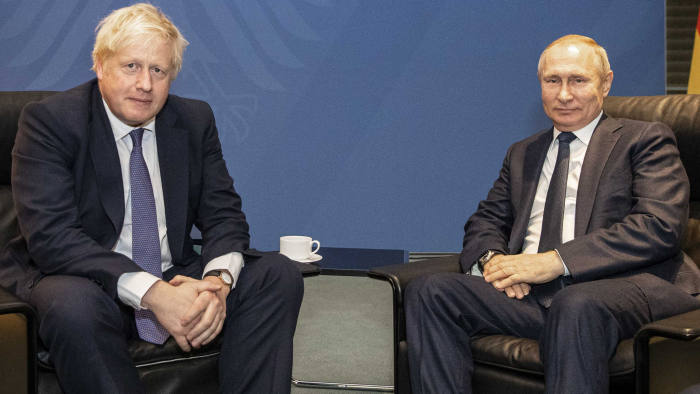 Boris Johnson and Vladimir Putin chat on the sideline during a summit in Berlin earlier this year. Credit: Reuters