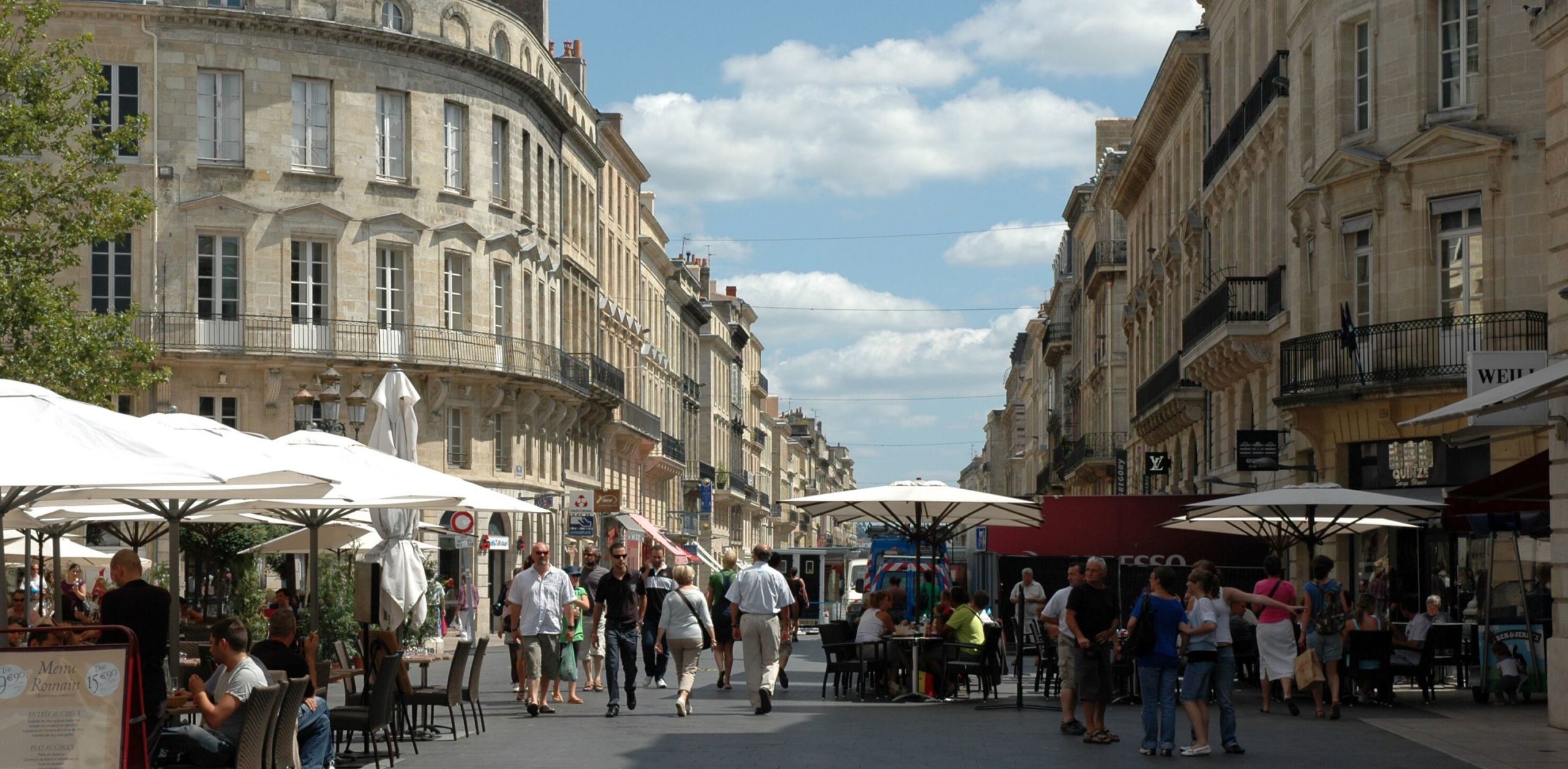 Cafe tables and market stalls in Bordeaux. Credit: Create Streets