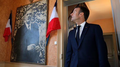 Emmanuel Macron looks at a portrait of Charles de Gaulle in Colombey-les-Deux-Eglises
