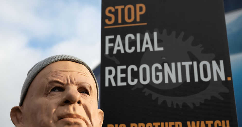 A man wears a mask in protest at AFR. (Photo by Matthew Horwood/Getty Images)