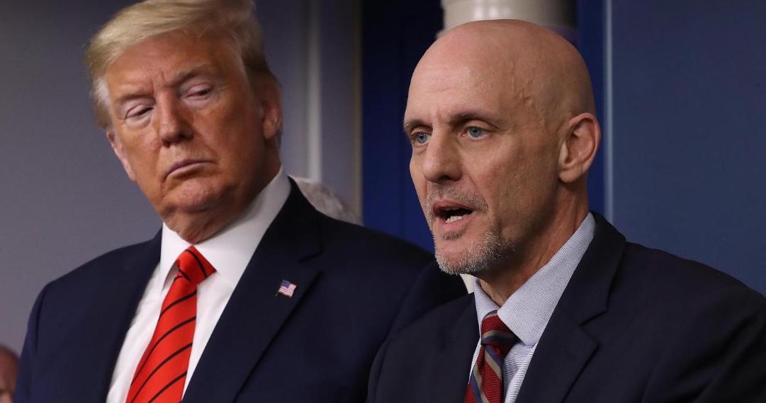 President Donald Trump listens to FDA Commissioner Stephen Hahn, who made a statistical error earlier this week