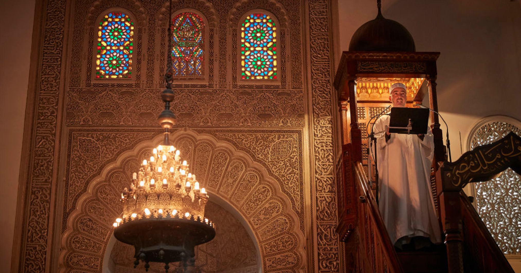An Imam reads a poem during Friday prayers in France. Credit: Getty