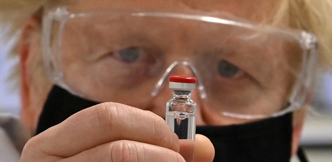 Boris Johnson holds a vial of the AstraZeneca/Oxford University Covid-19 candidate vaccine. 