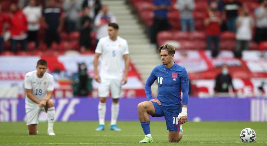 Jack Grealish takes a knee in support of the Black Lives Matter movement prior to the international friendly match between England and Romania