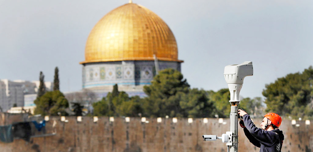 Smile! You're being monitored.  (Photo credit should read AHMAD GHARABLI/AFP via Getty Images)