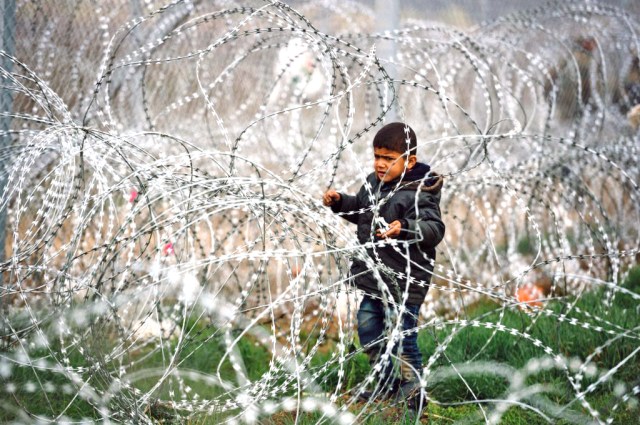 A child on the Greek-Macedonian border (DIMITAR DILKOFF/AFP via Getty Images)