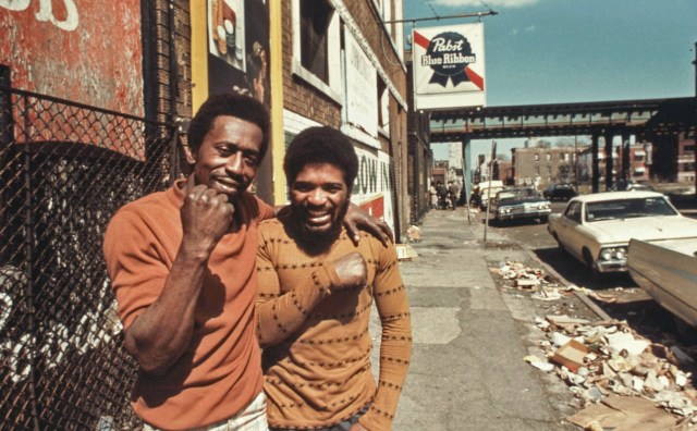 Two men on a street in the South Side, 1974 (Smith Collection/Gado/Getty Images).