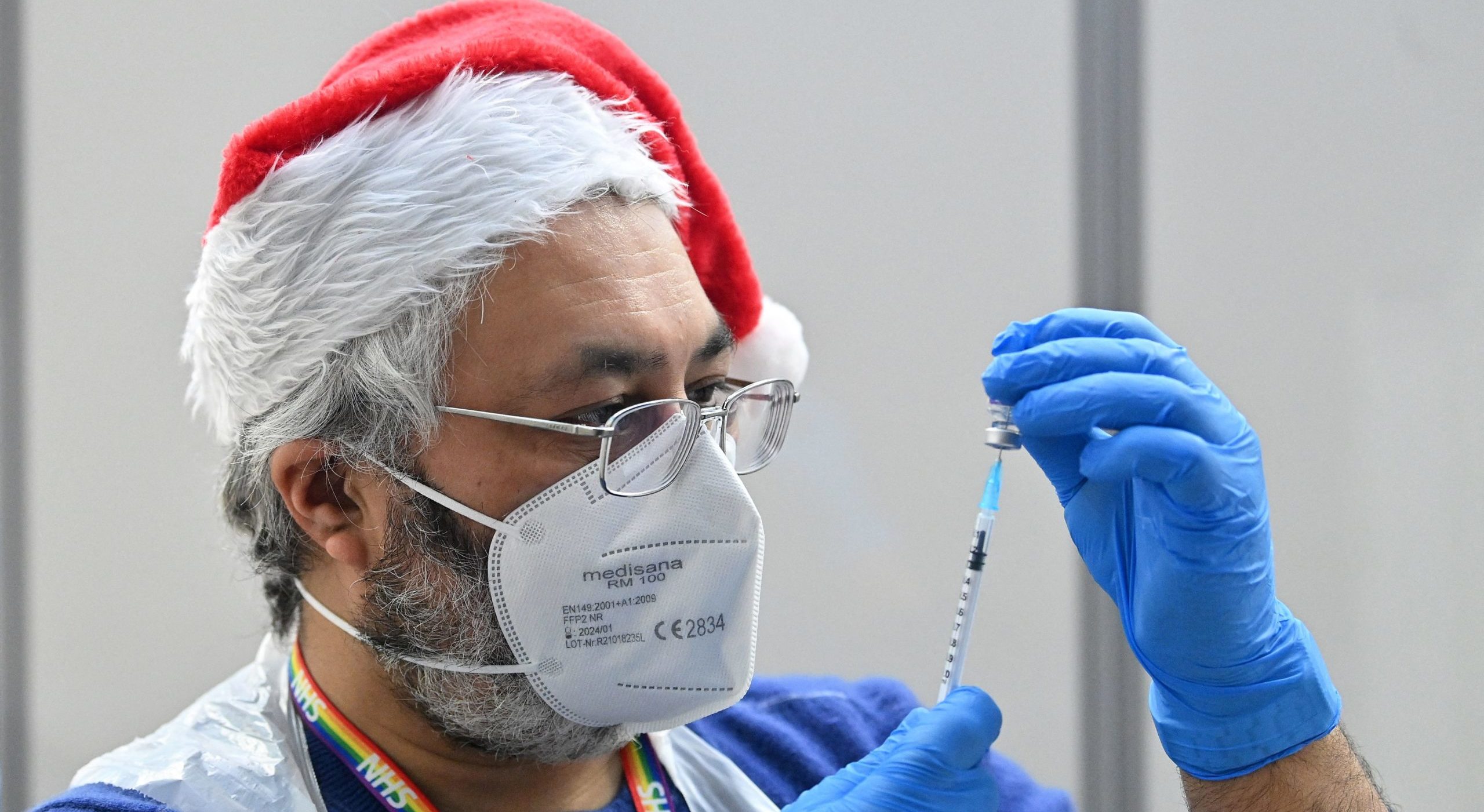 Did the booster programme give England a merry Christmas? (Photo by JUSTIN TALLIS/AFP via Getty Images)