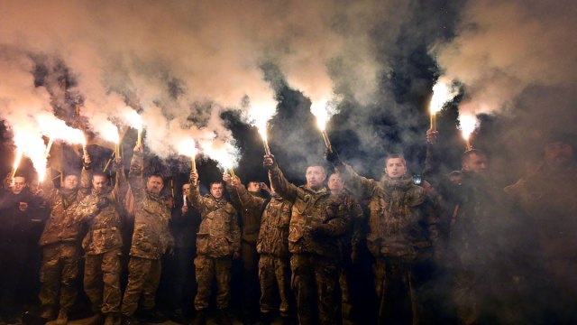 Torch-bearing Azov fighters. Credit: Genya Savilov/AFP/Getty
