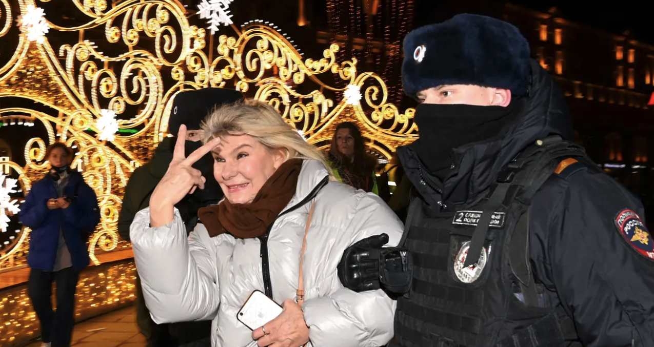 Police officers detain a woman during a protest against Russia's invasion of Ukraine in Moscow. Credit: Getty