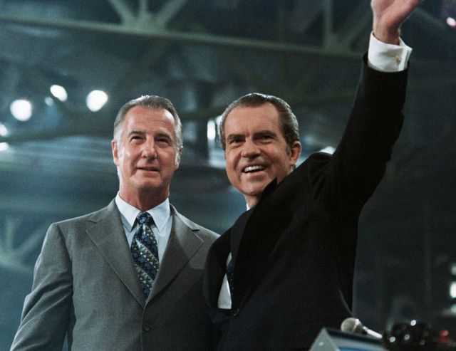 Pictured: Nixon and a crook. Via Getty