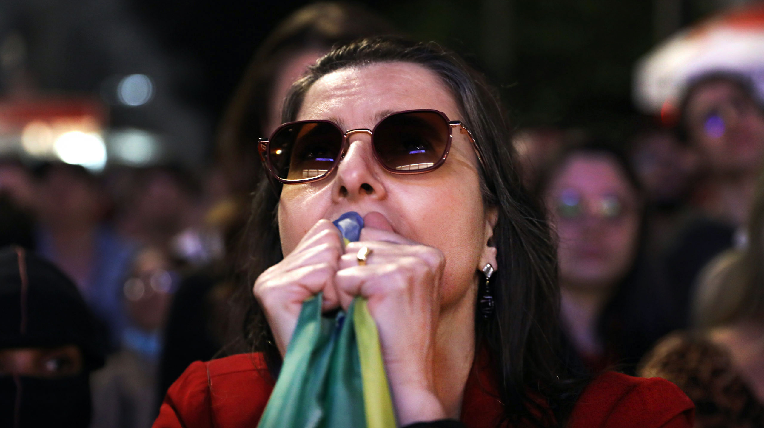 A Lula supporter waits for the results of Brazil's election. Credit: Getty