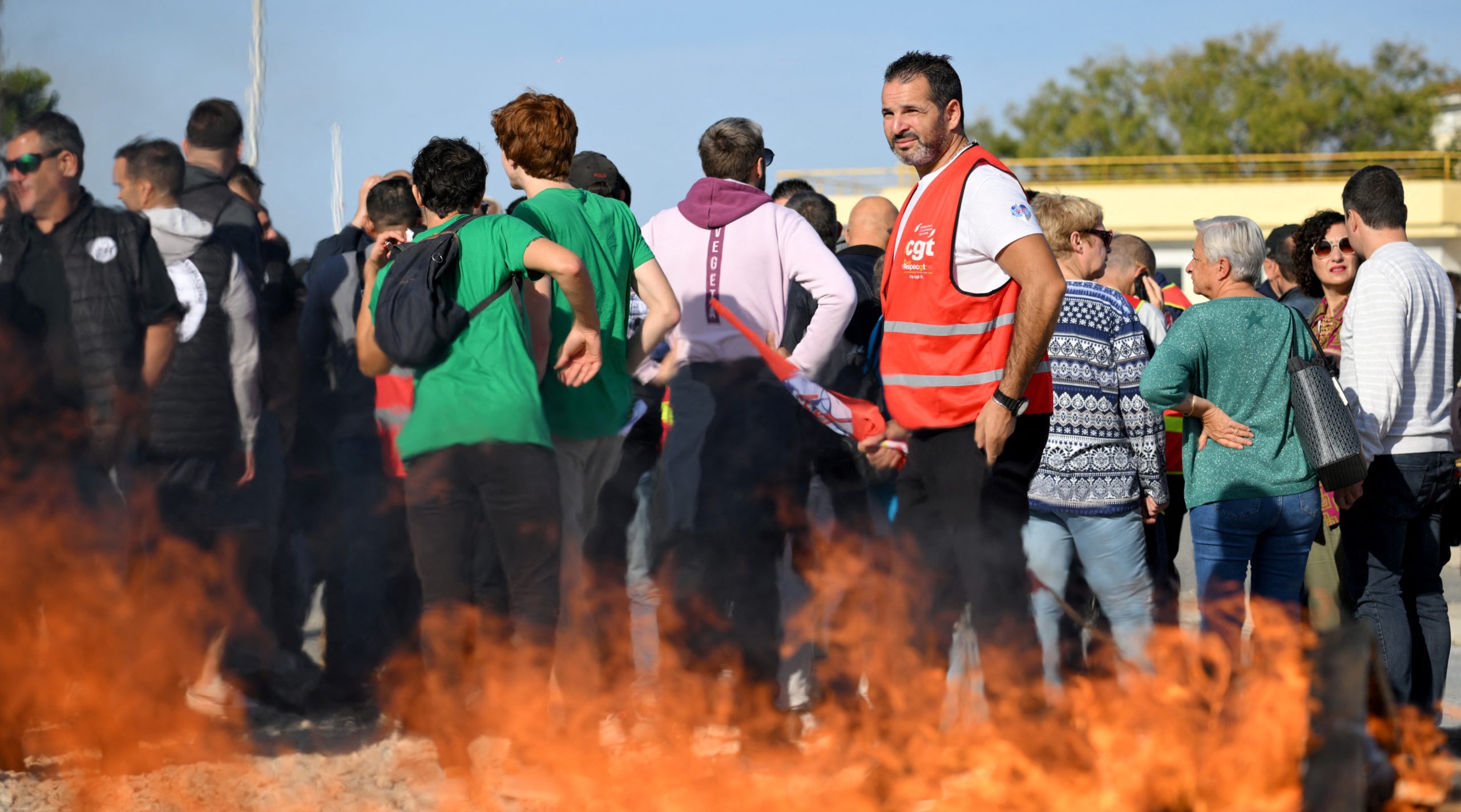 Striking oil workers protest outside an Exxon oil refinery. Credit: Getty