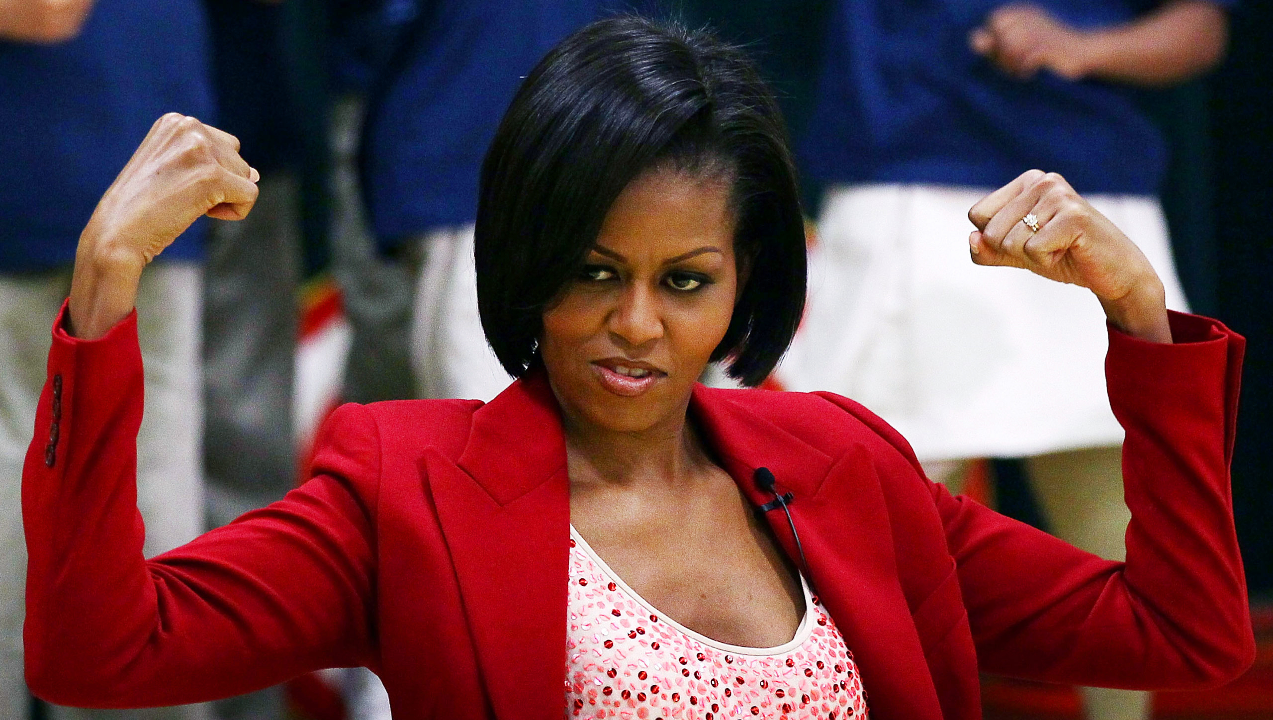 Former First Lady Michelle Obama flexes her muscles. Credit: Getty