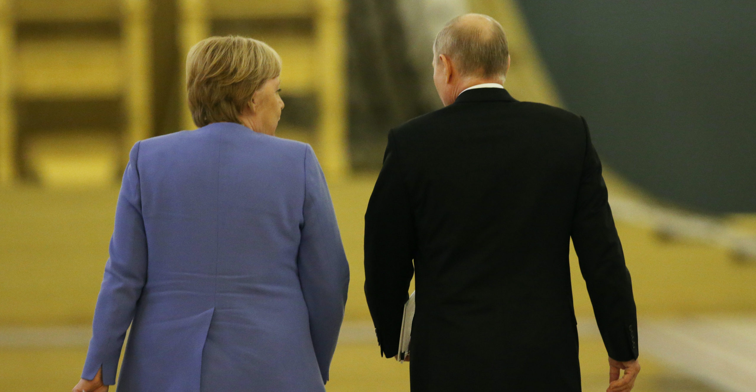 Russian President Vladimir Putin (R) and German Chancellor Angela Merkel (L). Credit: Getty