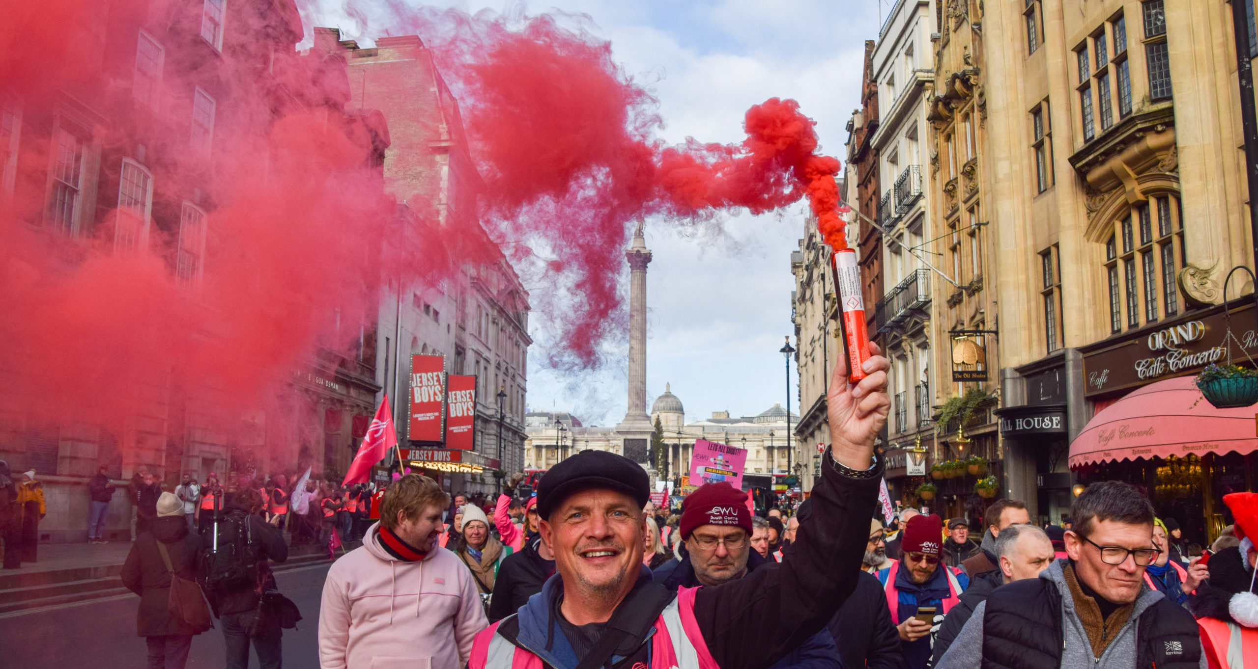 A protestor in Whitehall during this month's postal strikes. Credit: Getty.