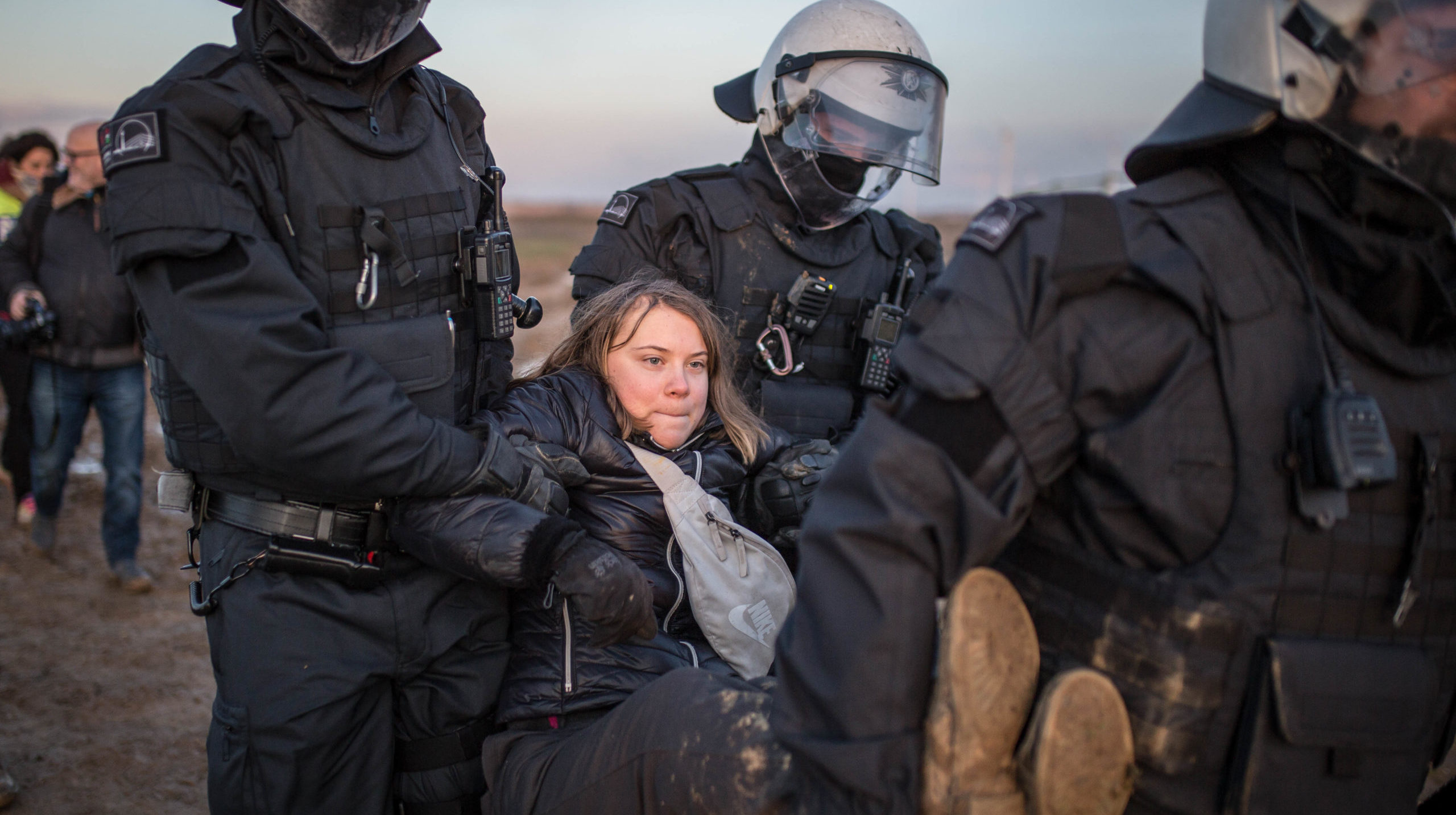 Police officers detain Greta Thunberg in Germany earlier this week. Credit: Getty.