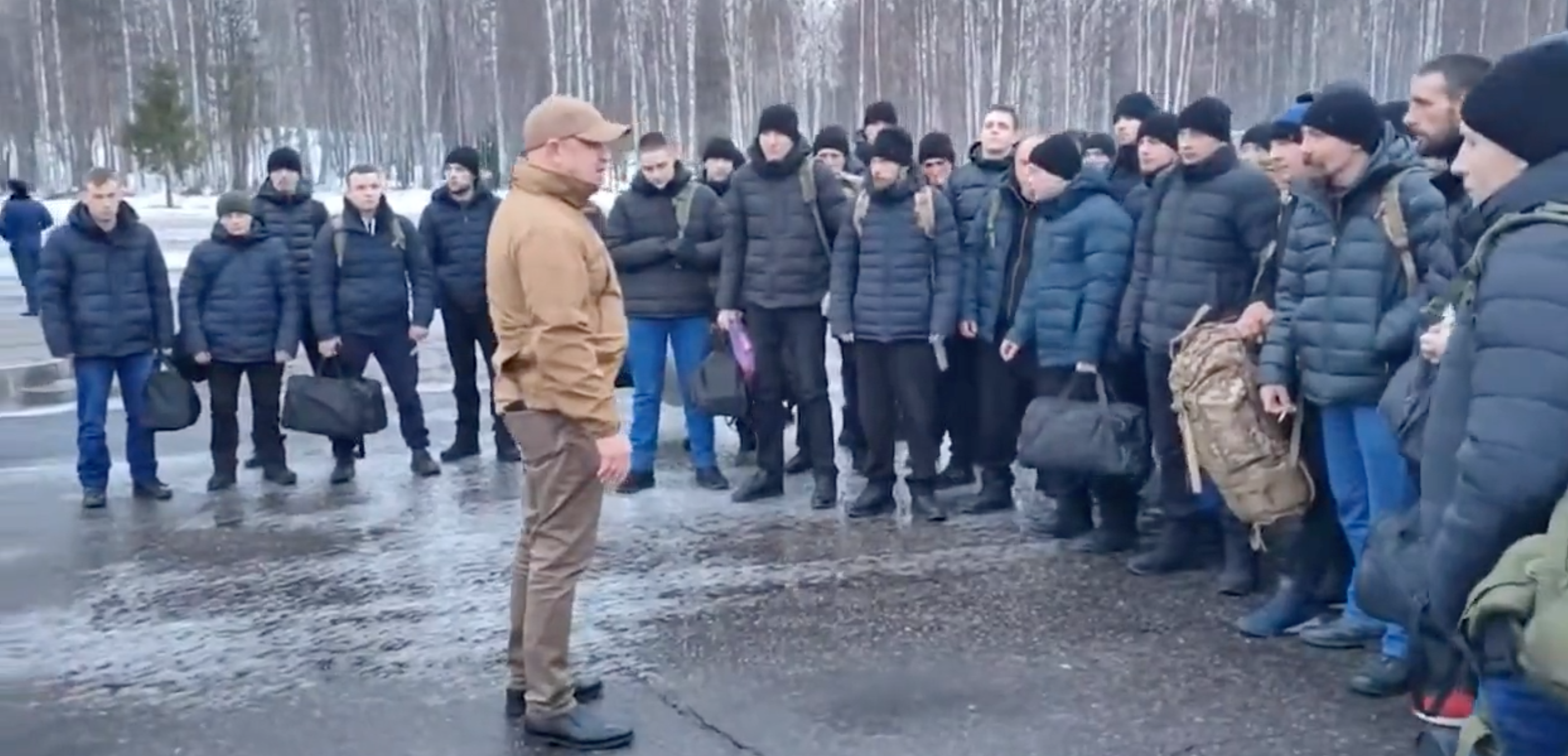 Yevgeny Prigozhin pictured alongside prisoners recruited into the Russian army.