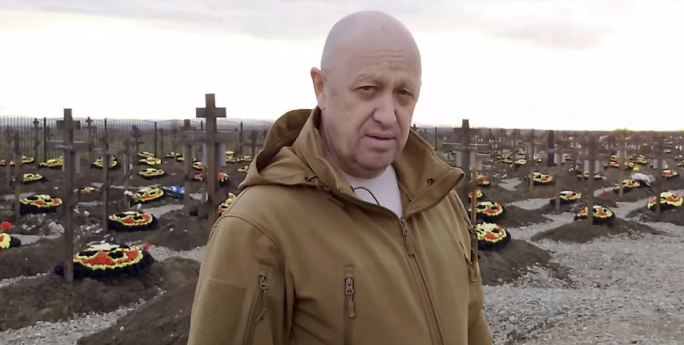 Yevgeny Prigozhin stands at a cemetery for fallen Wagner mercenaries in Russia