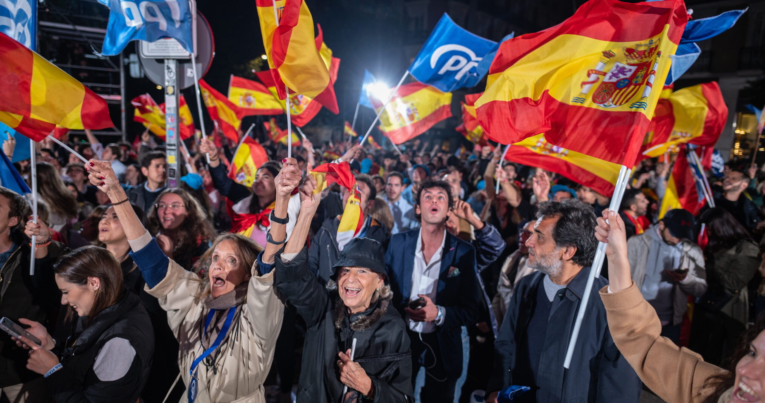 Supporters of the People's Party (PP) celebrate on Sunday night. Credit: Getty