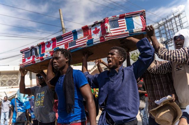 Demonstrators protest in Port-au-Prince (RICHARD PIERRIN/AFP via Getty Images)