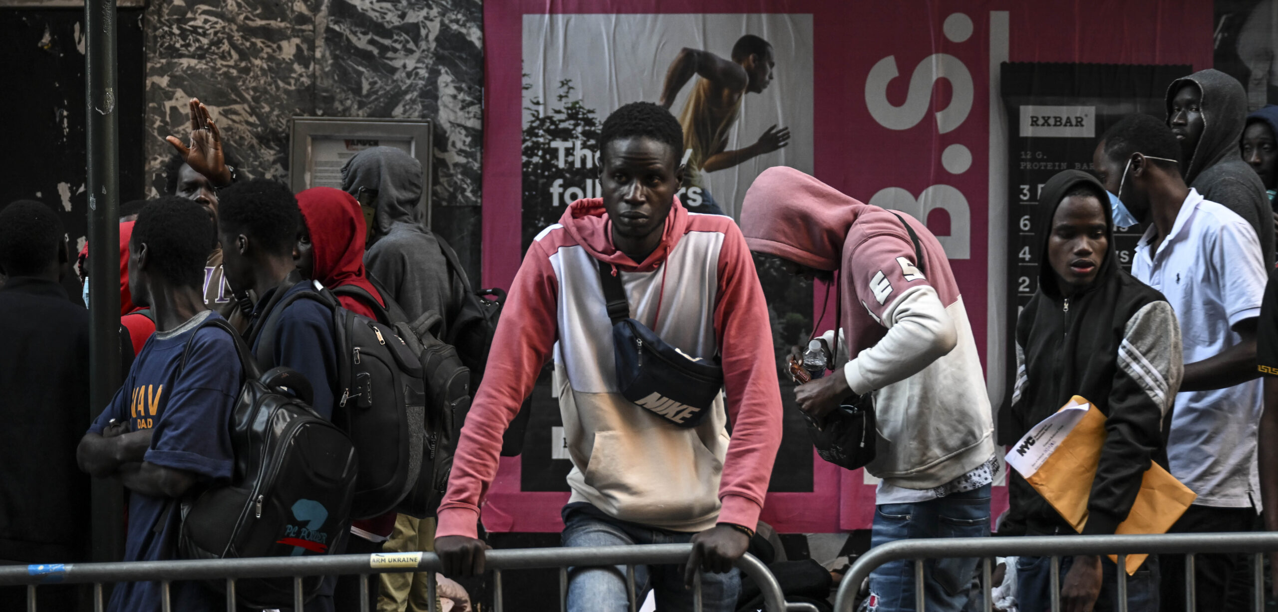Migrants line up outside Roosevelt Hotel in New York. Credit: Getty