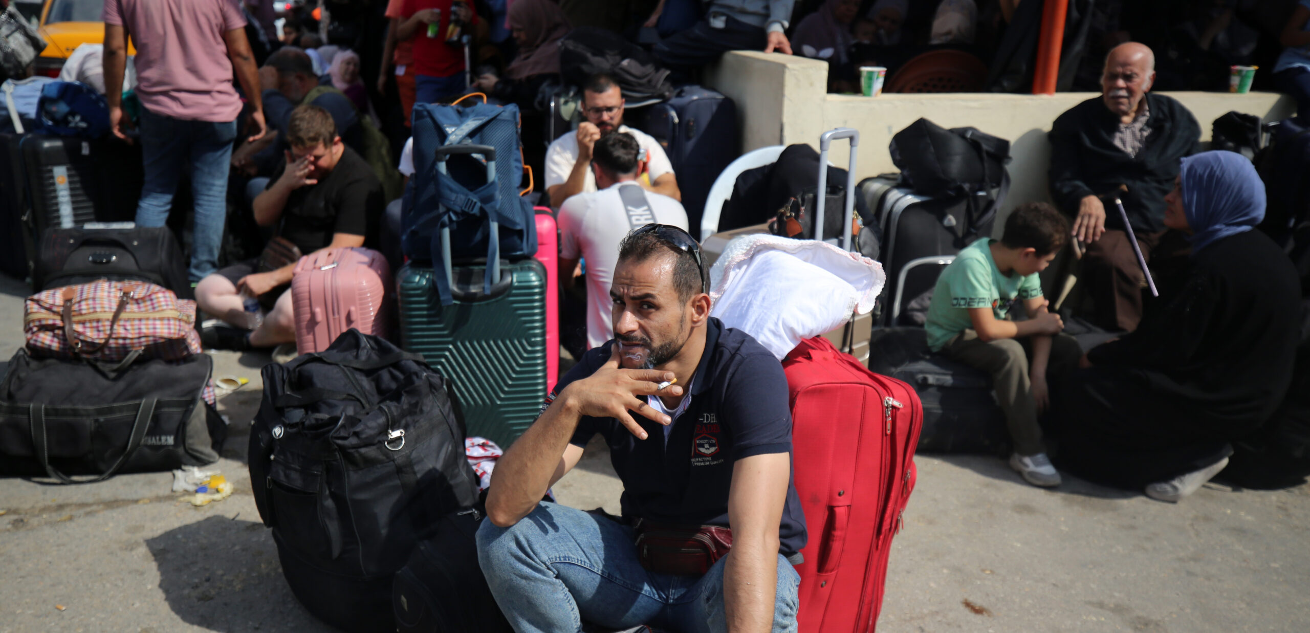 Palestinians wait at the Rafah crossing in the southern Gaza strip. Credit: Getty