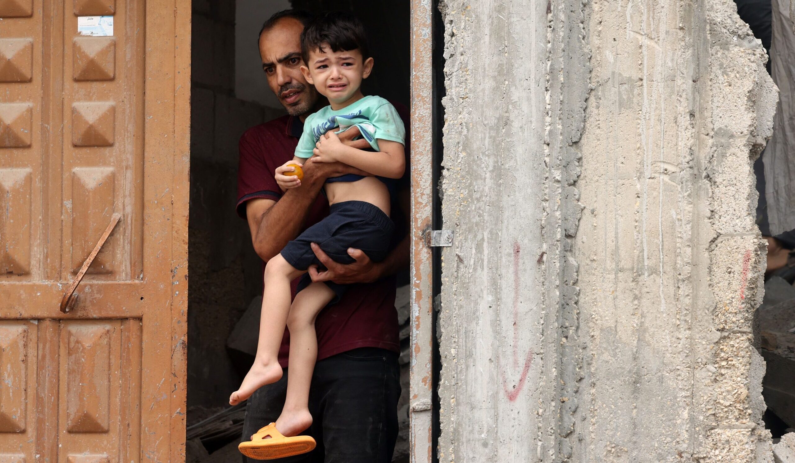 A man and boy in the aftermath of an Israeli bombing of the Gaza Strip on Sunday. Credit: Getty