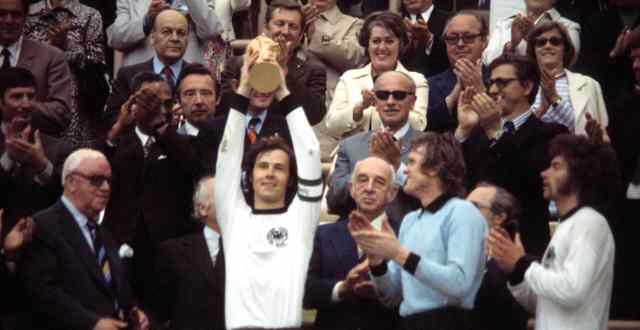 Franz Beckenbauer lifts the 1974 World Cup trophy as West Germany captain. Credit: Getty