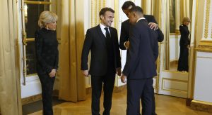 Why is Macron meeting Kylian Mbappé again?