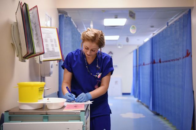 Doctors need help with admin, not diagnosis. (OLI SCARFF/AFP via Getty Images)