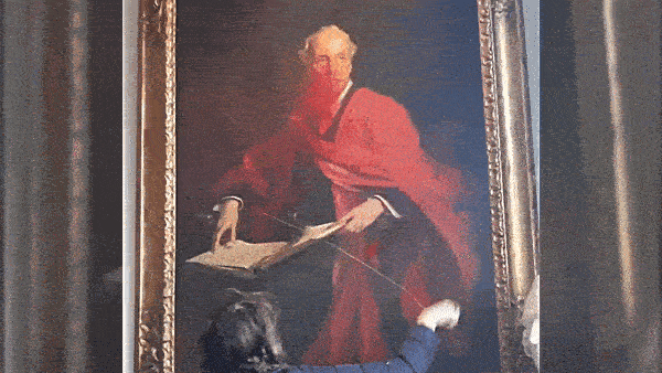 Pro-Palestine protesters slash a portrait of Balfour