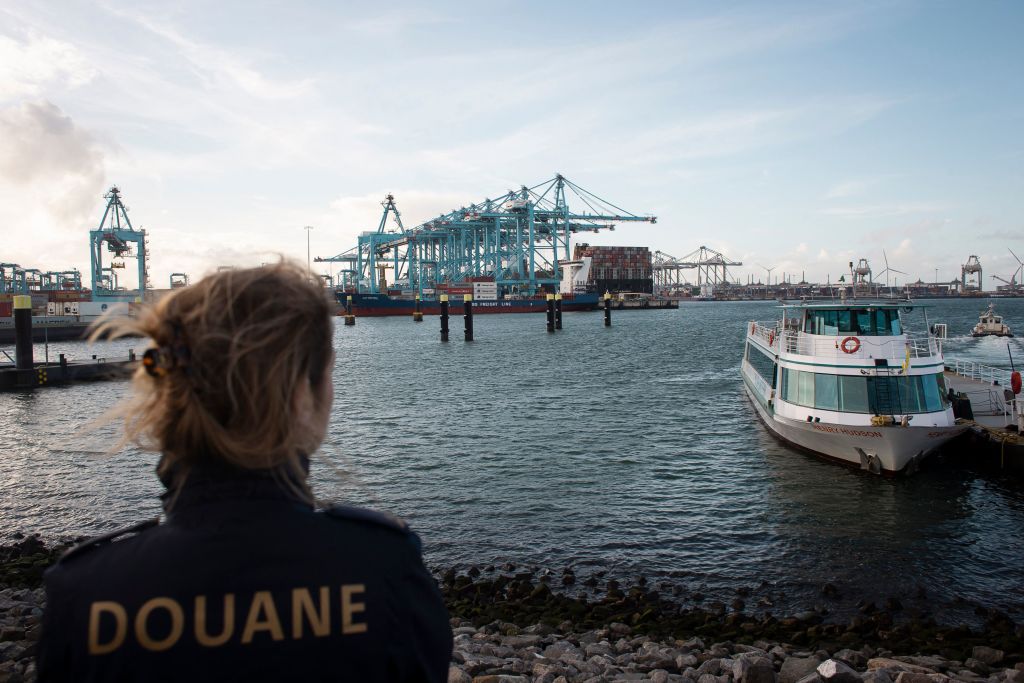 A customs officer looks on as cocaine is intercepted in Rotterdam's harbour. Credit: Getty 