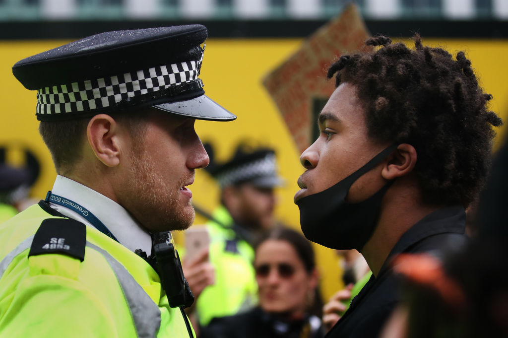 A BLM protester confronts a policeman in June 2020. Credit: Getty