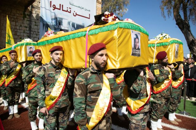 Hezbollah members take part in the funeral this week for four people killed in an Israeli air raid in southern Lebanon. Credit: Getty