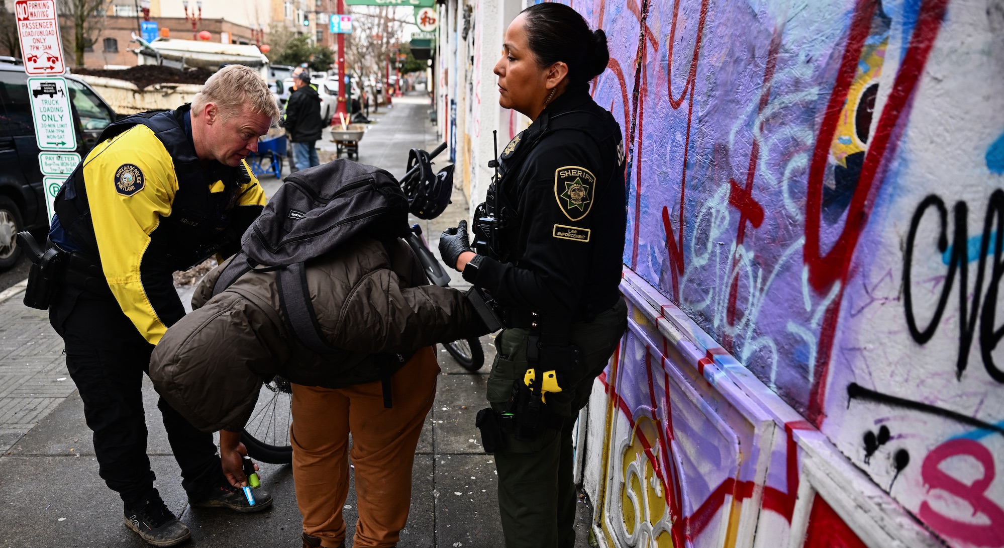 Police in Oregon investigate a homeless man on suspicion of drug dealing earlier this year. Credit: Getty