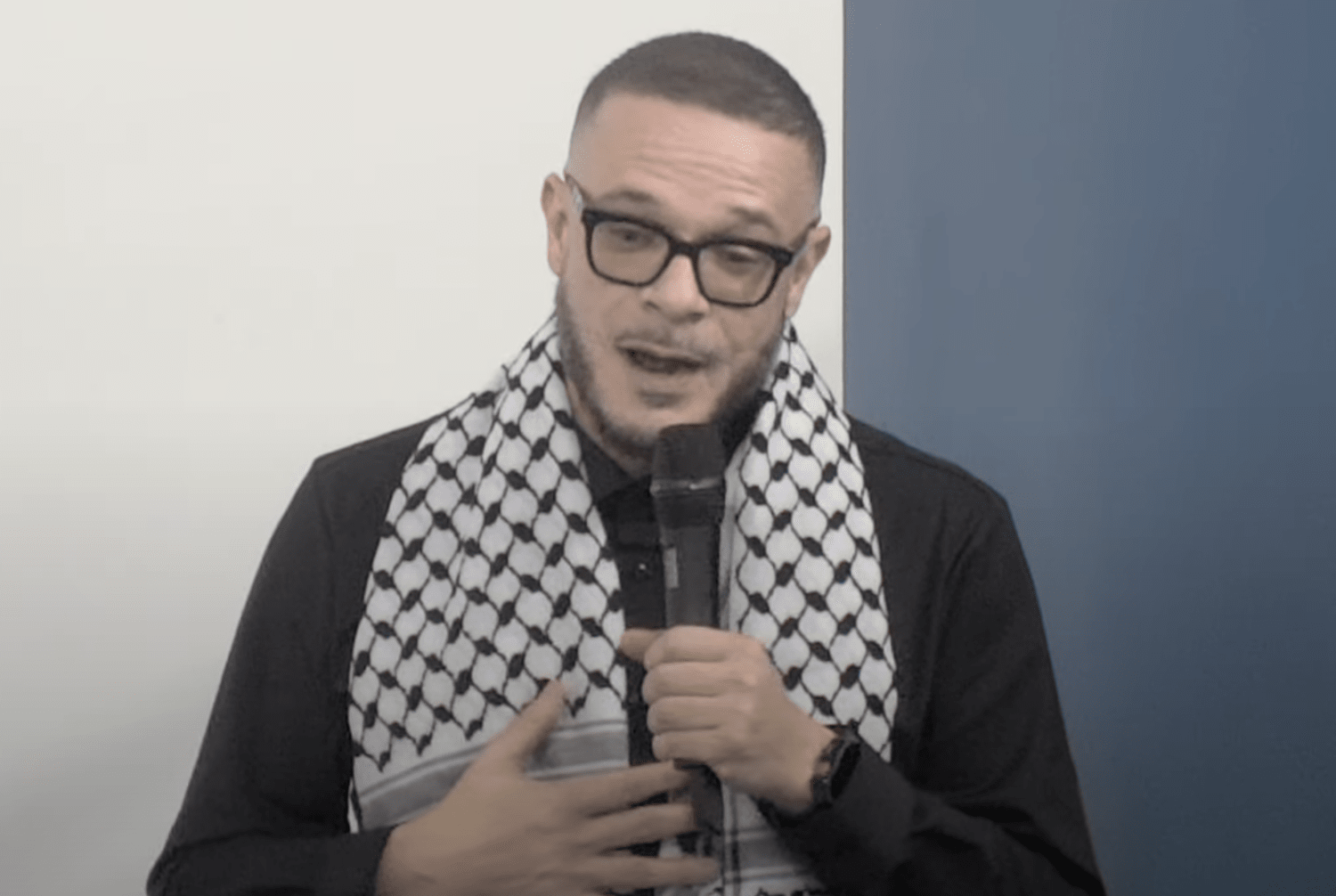 Shaun King dons a keffiyeh while he explains why he converted. Credit: YouTube