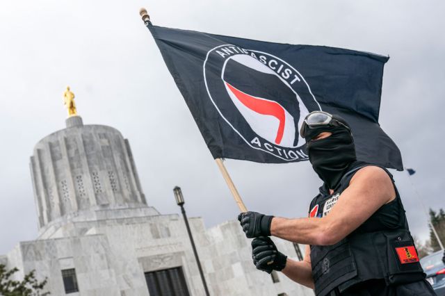 Should Antifa protestors really be treated as gang members? Credit: Getty