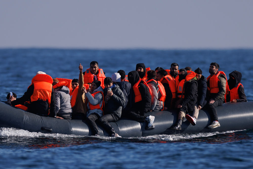 Migrants pictured crossing the English Channel earlier this year. Credit: Getty
