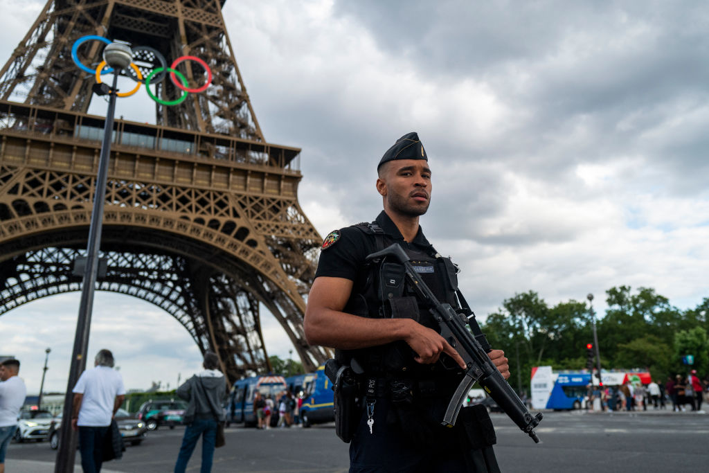A French gendarme patrols near the Eiffel Tower. Credit: Getty