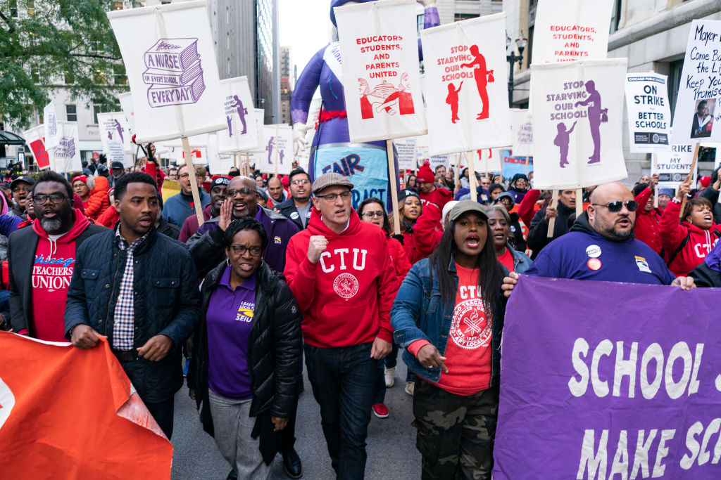 Chicago Teachers Union officials march in downtown Chicago. Credit: Getty