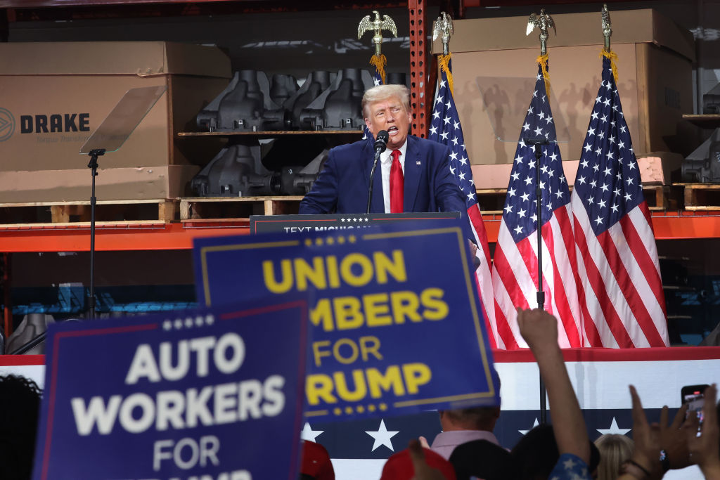 Donald Trump speaks at an automotive parts manufacturer in Michigan last year. Credit: Getty 